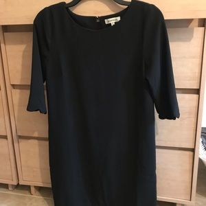 Scalloped hem dress on sleeves and at bottom